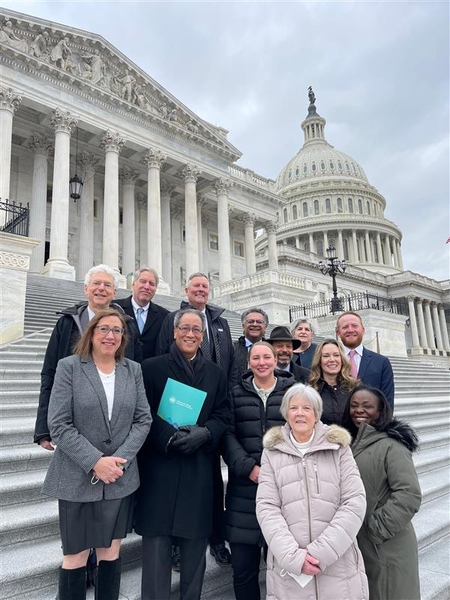 Board members of the Asthma and Allergy Foundation of America standing on the steps of Capitol Hill